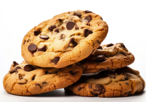 A stack of chocolate chip cookies is visible. The cookies have a golden-brown color with plenty of chocolate chips spread throughout, tempting to eat.