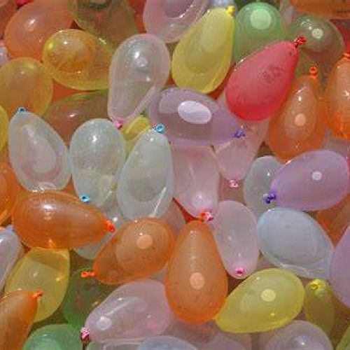 The image shows a large collection of colorful, water-filled balloons in various shapes and sizes.