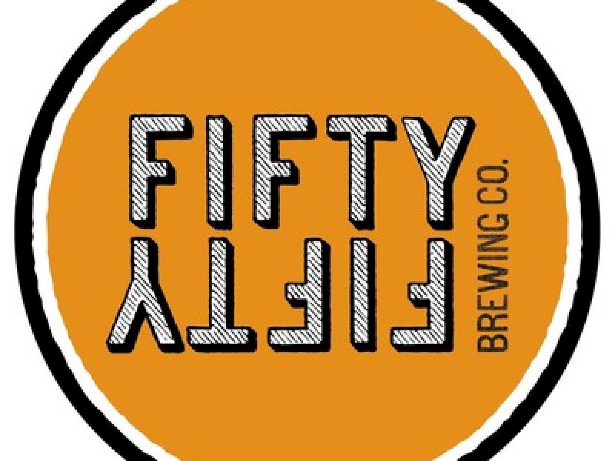 The image displays a round logo with "FIFTY FIFTY BREWING CO." text on an orange background, bordered in black and white.